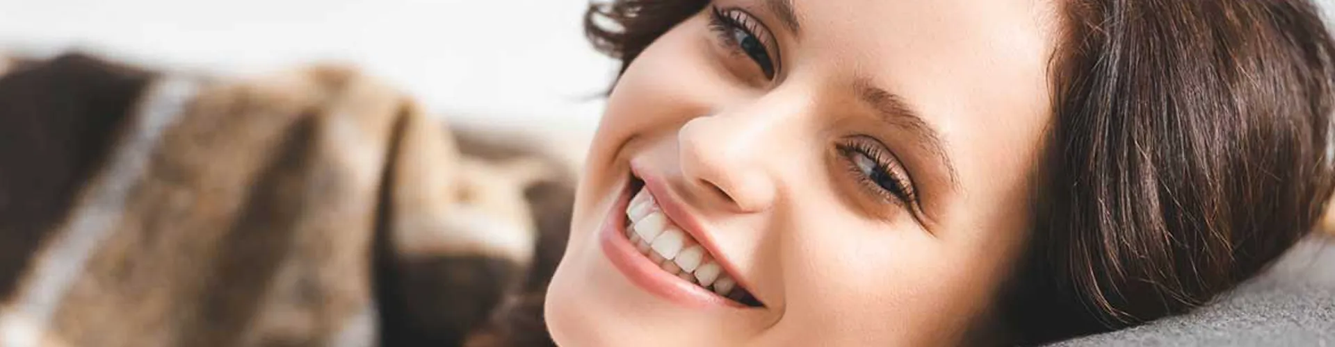 A woman smiling.